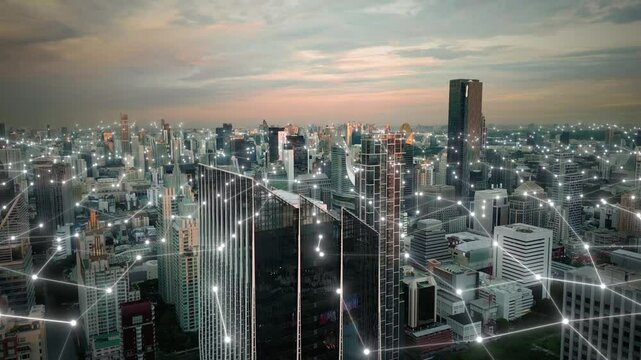 Aerial skyline at sunset modern smart digital city with animation of computer data web connection