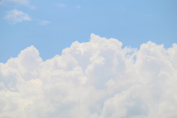 Naklejka premium The sky was bright blue with pure white clouds like soft cotton. Full frame shot. Cloudly sky blue sky background