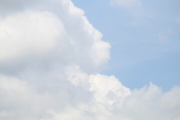 The sky was bright blue with pure white clouds like soft cotton. Full frame shot. Cloudly sky blue sky background