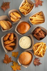 Fototapeta premium Autumn Feast Greasy Delight with Burgers, Fries, and Fried Chicken on Wooden Table