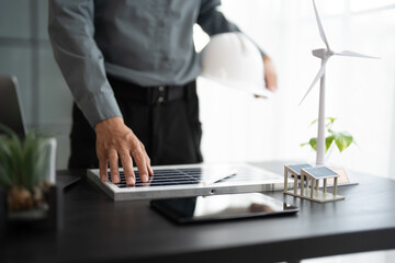 Engineer planning for Solar panels green energy Business man working Innovation  green eco friendly in modern office business  Planing Bio economy for business renewable energy eco friendly