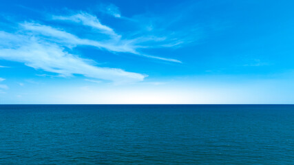 Nature of the beach and sea Summer with sunshine, sandy beaches, clear blue waters sparkling against the blue sky. On an island with good ecology and environment Background for summer vacation concept