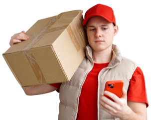 Delivery man looking at the mobile to buy the address where to deliver. a young loader in a red uniform with a smartphone in his hand. isolated background.