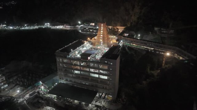 An aerial video of Kanaka Durga Temple in Vijayawada would offer a breathtaking panoramic view of this revered Hindu shrine. Nestled atop Indrakeeladri Hill, the temple's golden gopuram at night.