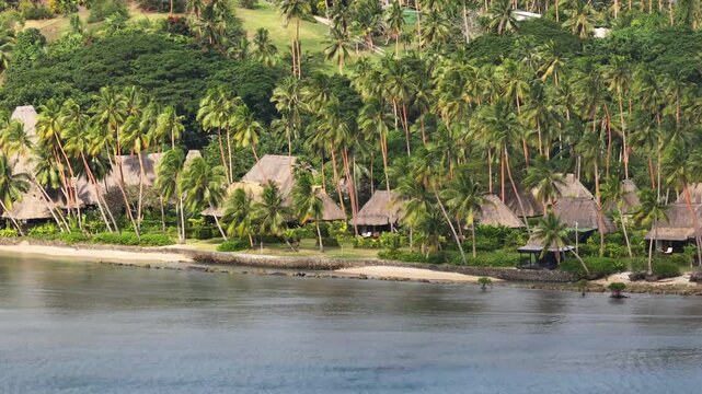 Luxury resort buildings and palm tree on Vanua Levu Isand shore in Fiji. Amazing drone panoramic