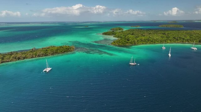Stunning Aerial View Of Tropical Islands In Vava'u With Boats Anchoring In Tonga. approaching, wide shot