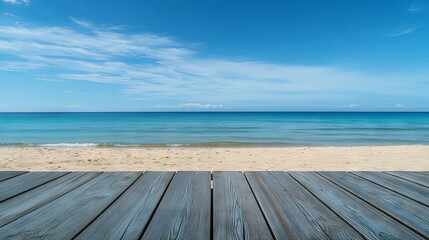 Fototapeta premium Wooden floor or plank on a sandy beach in summer with calm sea and blue sky, perfect for product display and mockups