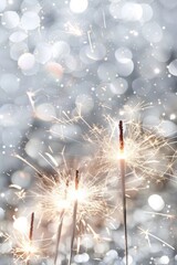 Fototapeta premium Enjoy a Festive Sparkler Celebration with Glowing Fireworks and Bokeh Lights illuminating the night. Celebrate joy, excitement, and magic with vibrant lights and glittery sparklers