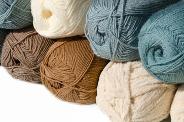 Trendy colors of wool yarn. Merino and plush yarn on white background.