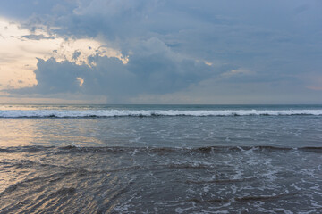 Seascape of Cloudy Ocean with the Beach in Horizontal at Kuta, Bali, Indonesia.