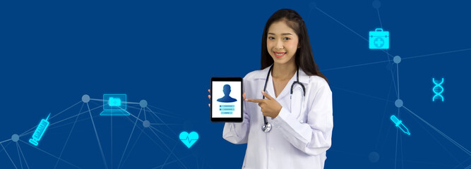 Young asian doctor in white gown pointing at tablet computer monitor with user login page display on screen. Concept and idea for healthcare technology, innovation medicine, science and research.