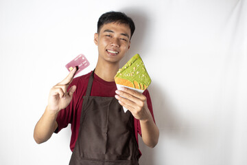 smiling teenage bartender with snacks and cards in his hand