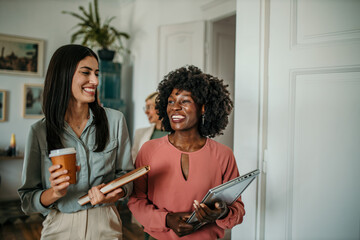 Business coworkers walking and working together in the office