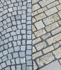 Top view of the cobblestone flooring with small gravel grouting on the street of western Europe