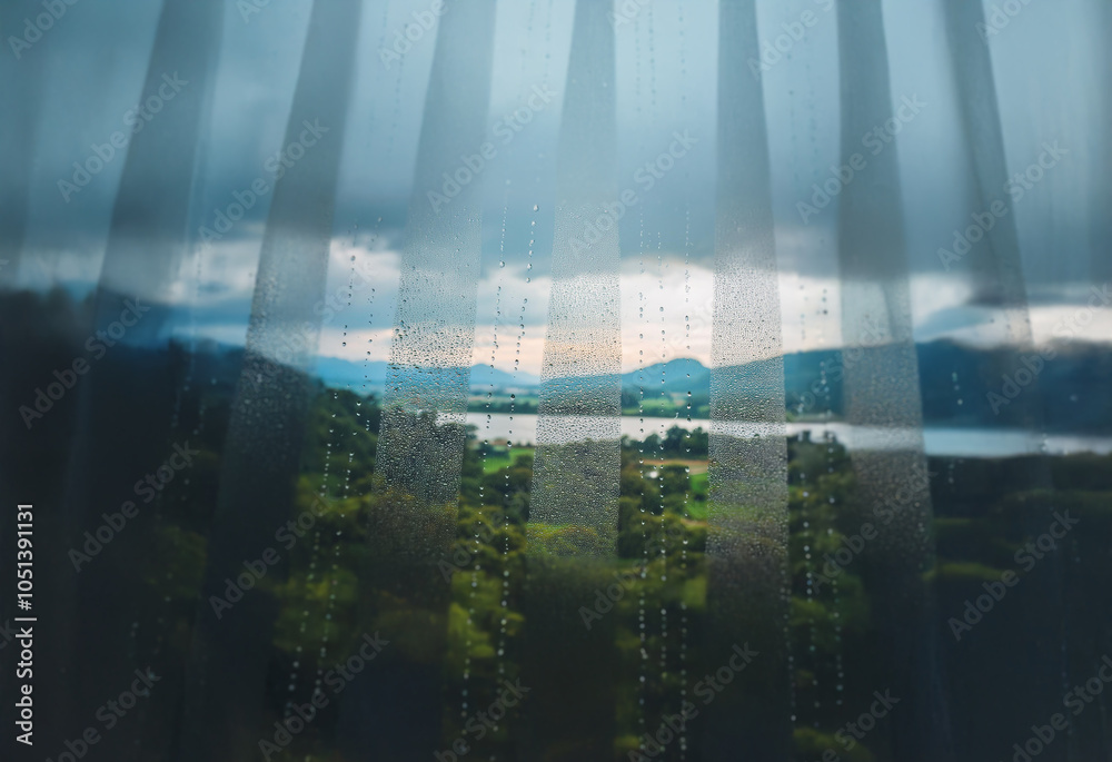 Poster A view of a lake and mountains through a sheer curtain with raindrops.