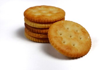 stack of round salted biscuits isolated on white
