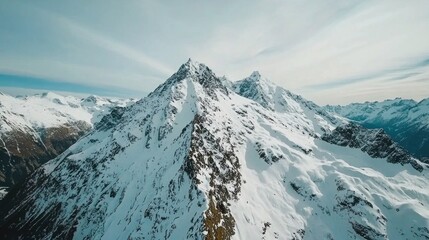 A breathtaking aerial perspective of the majestic aurora borealis dancing over snow-capped peaks in high definition quality