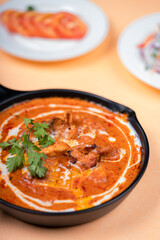 An Indian Curry with fresh cream in a bowl