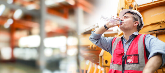 Thirsty and tired worker setting on the floor.
