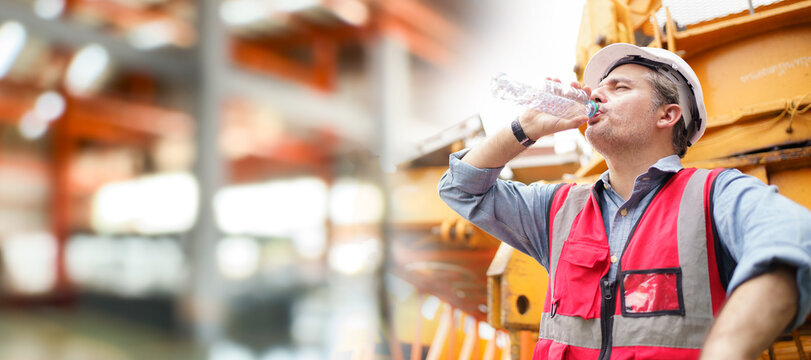 Thirsty and tired worker setting on the floor.