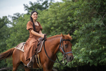 happy woman riding horse on meadow field