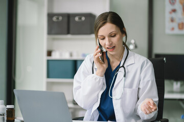 Female medicine doctor, physician or practitioner involved in cellphone call conversation giving professional consultation to patients. Medic tech concept.
