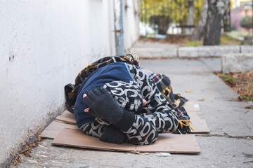 Homeless man sleeping. Poverty concept