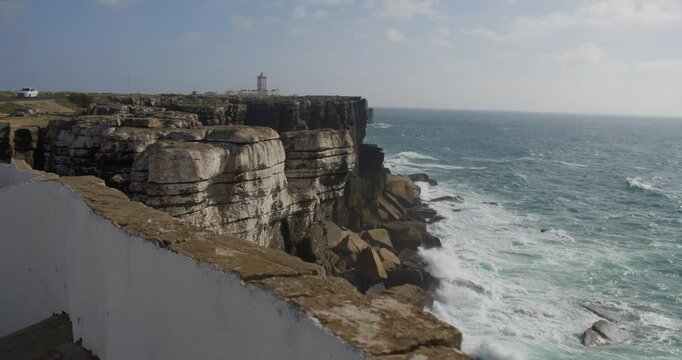 Unique Coastal Rock Formations by the Sea in slow motion, day. This is in Peniche, Portugal. With a view to the atlantic ocean