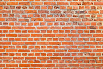 Naklejka premium Red brick wall background, Retro style brick texture.