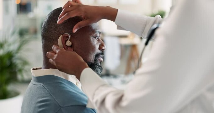Doctor, hearing aid and healthcare with people in clinic for results, cochlear implant and medical. Helping, appointment and support with patient in hospital for diagnosis, physician and feedback