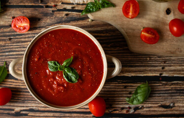 fresh tomato soup in a bowl. on a wooden table. food