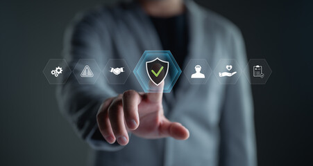 Work safety concept. Businessman show the icon of safety at workplace sour rounded by safety first,...