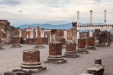 Columns remaining from ancient structures. Archaeological sites in Italy.