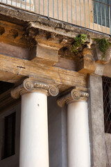 Ionic capitals on columns of a Palladian house.