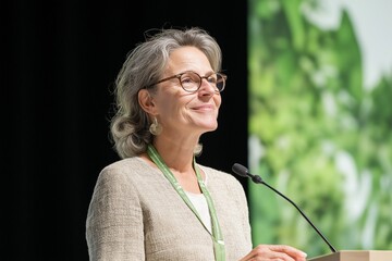 Successful female CEO delivers an inspiring keynote speech at an executive leadership conference focused on innovation and sustainability in business practices