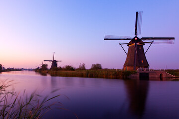 Sunset View of Dutch Windmills at Kinderdijk by the Water