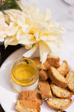 Breads with honey served in plate on table at party