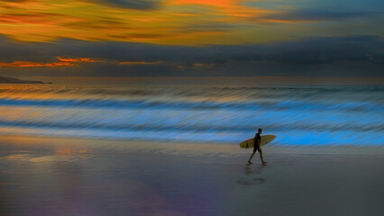 fine art photography surfer coming out of the water at sunset © Miguel Diaz Ojeda