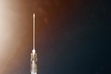 Closeup of medical syringe needle with copy space