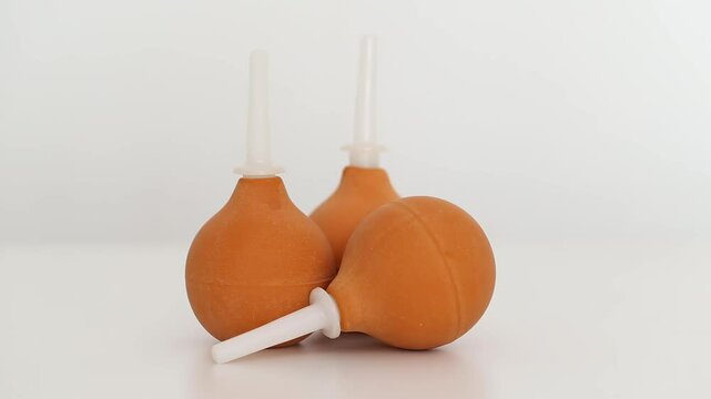 Brown medical syringes on a white background, isolate, close-up, instrument