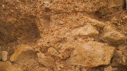 Wall made of marble pieces and mixture of crushed ceramics and marble sand, pastel colors, warm shades, beautiful background, indestructible walls, construction production and technology, close-up, It