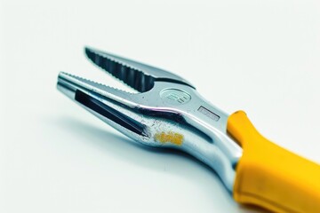 Obraz premium A pair of pliers lying on a clean and empty white surface