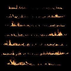 Seven different lines of fire burning on a black background