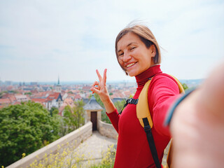 Tourist woman explores beautiful city of Erfurt, wandering through its historic streets, admiring...