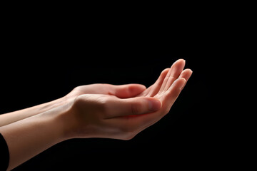 Fototapeta premium Praying Hands with White Embroidered Robe Against Dark Background