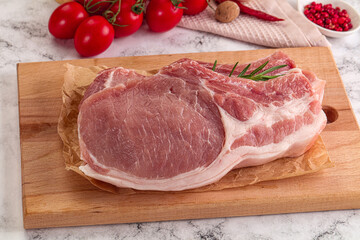 Raw potk loin steak with bone
