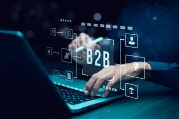 Fototapeta premium The concept of Business-to-Business (B2B) trade involves meeting business needs, product manufacturing, organizational development, transportation business, online marketing, through an e-Commerce