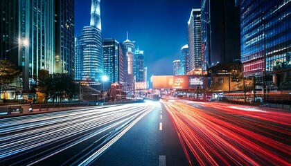 Naklejka premium Busy City Street at Night with Car Light Trails and Neon Signs