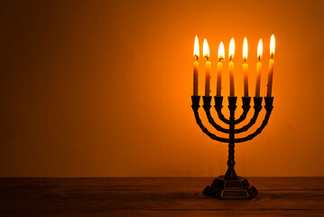 Fototapeta premium Hanukkah Menorah with burning candles