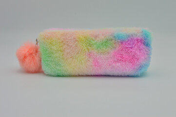Colorful pencil bag made of fur. Unique handbag made of fur with the color of rainbow